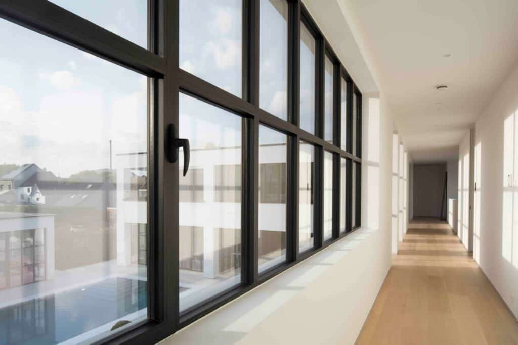 Showcase casement windows in a commercial business office hallway.