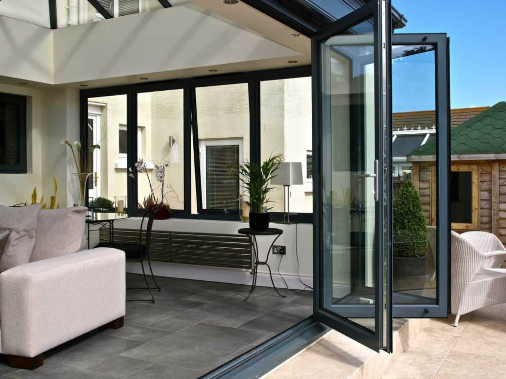 Folding glass doors opening onto a patio in a residential home.